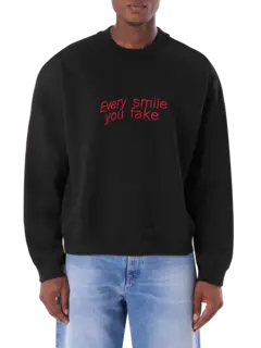سويت شيرت تياجو ألكسندر × إم إس جي إم مزين بعبارة "Every Smile You Fake"