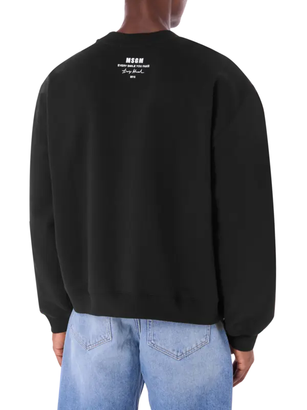 سويت شيرت تياجو ألكسندر × إم إس جي إم مزين بعبارة "Every Smile You Fake"