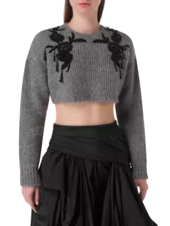 بلوزة محبوكة قصيرة بأكمام طويلة