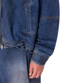 قميص بسحاب من الجينز المغسول بالزيت