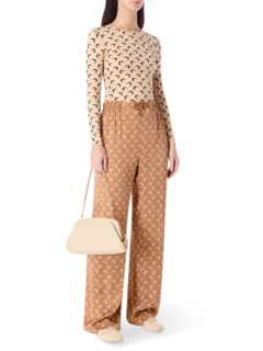 بلوزة من قماش الجيرسيه بفتحة رقبة مستديرة وطبعة قمر